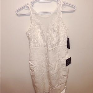 White fitted dress with sheer detailing